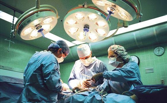 surgeons at an operating table